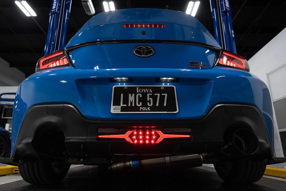 OLM V1 Rear Fog Light Clear Lens Black Base White Bar Subaru BRZ / Toyota GR86 2022-2026 | A.70258.1-B