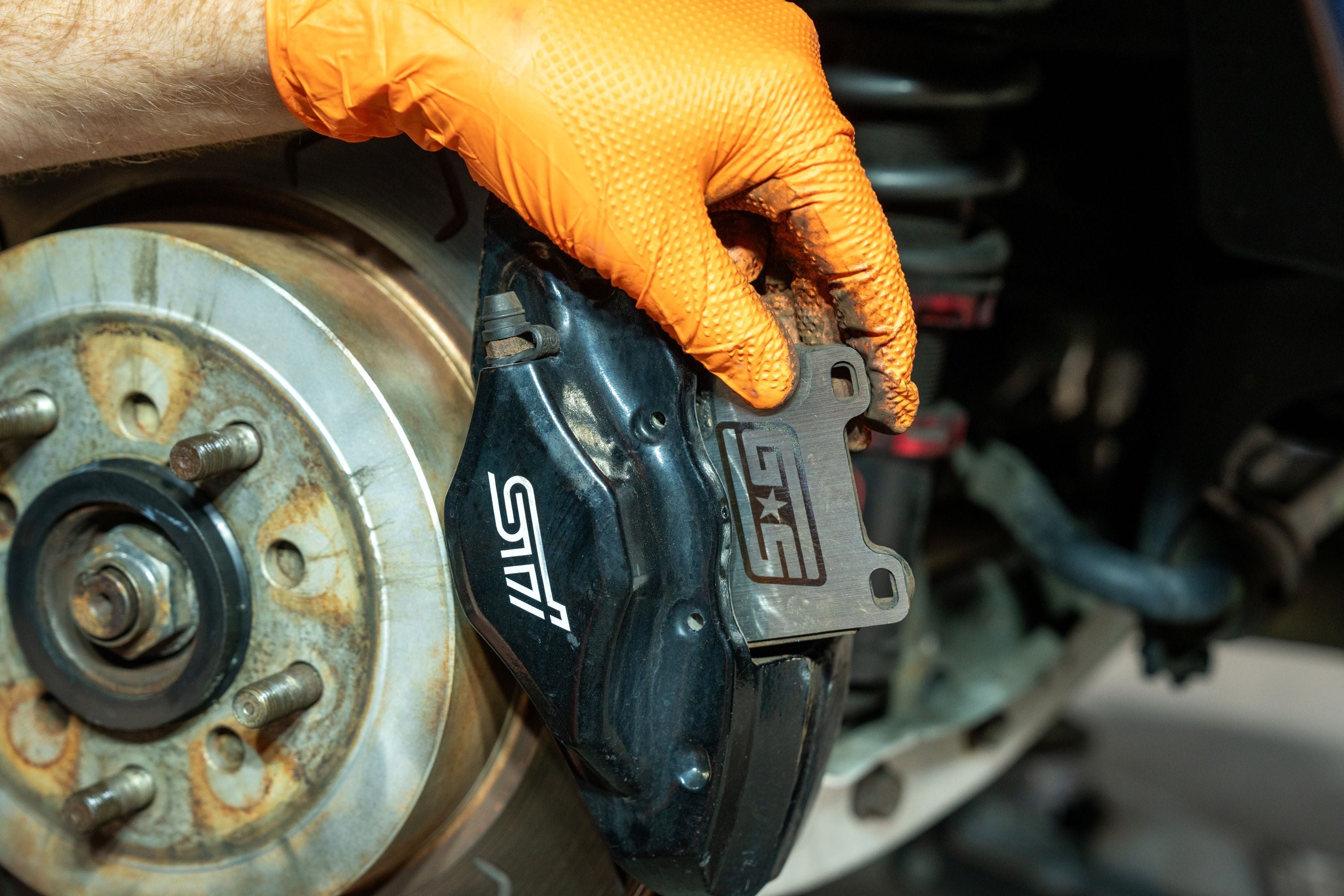 GrimmSpeed Titanium Rear Brake Shim Set Subaru STI 2004-2017 | 1247.1.TI