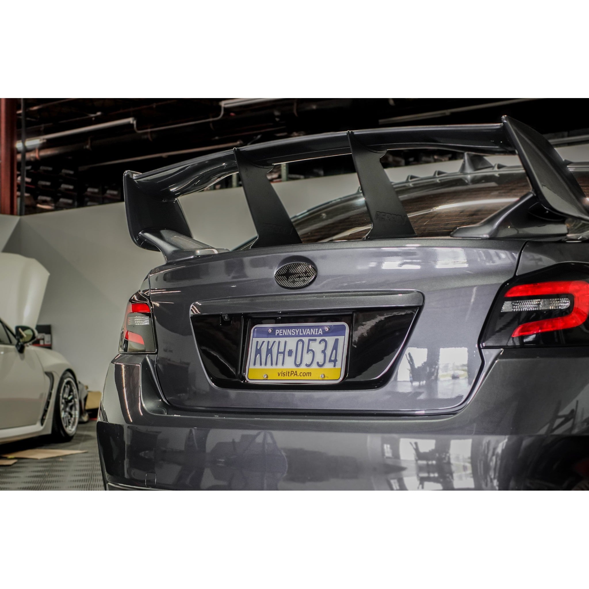 Noble Gloss Black License Plate Panel - 15-21 WRX / STI